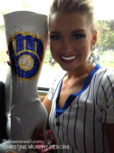 Miss Wisconsin holding boots embellished with Swarovski crystals by Christine Murphy Designs
