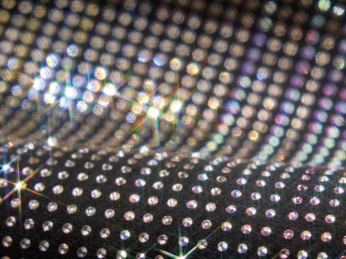 Macro close-up of ss3 Preciosa MAXIMA crystals catching light in dense rows