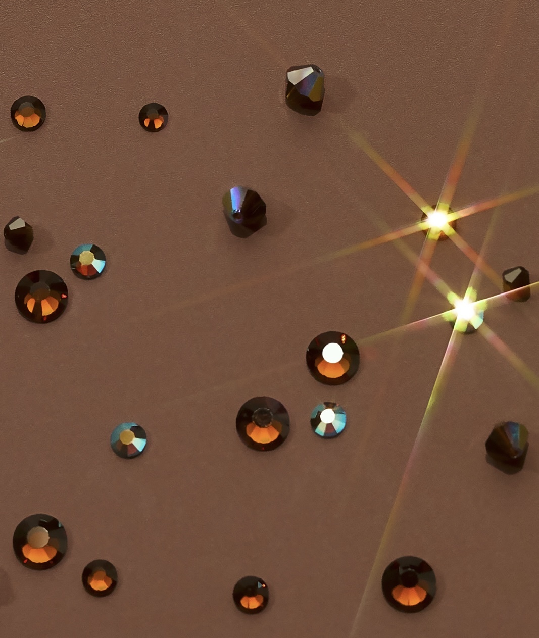 Preciosa Chocolate flatback crystals on draped bronze fabric